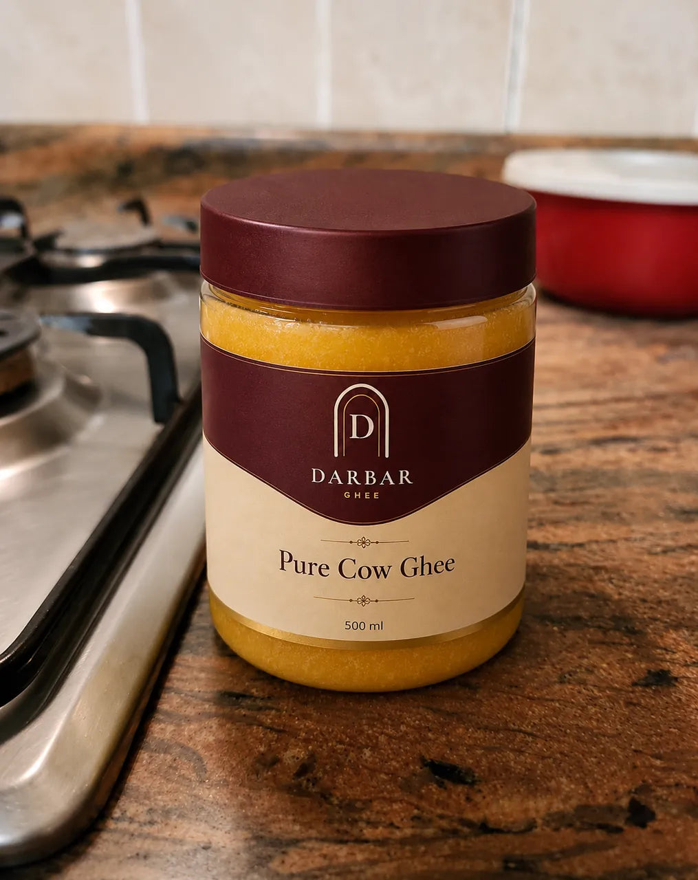 Darbar Pure Cow Ghee jar on a customer's kitchen counter beside the stove